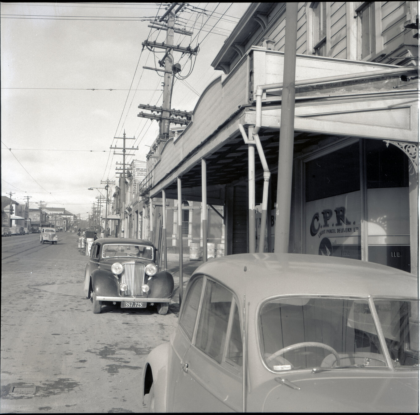 a. Two storey wooden building on the corner of Drummond Street and Adelaide Road, used for retail purposes - Jacobsons Laidies Coats and Costume, C P R light parcel delivery