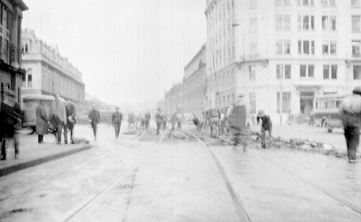 Customhouse Quay, workmen working on newly laid tram tracks