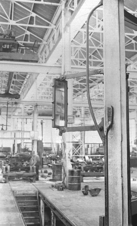 Rear view mirror attached to exterior of tram