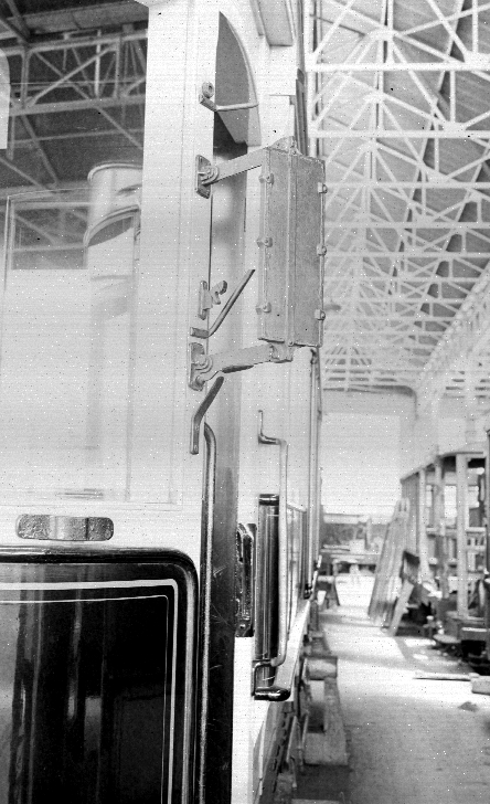 Rear view mirror attached to exterior of tram