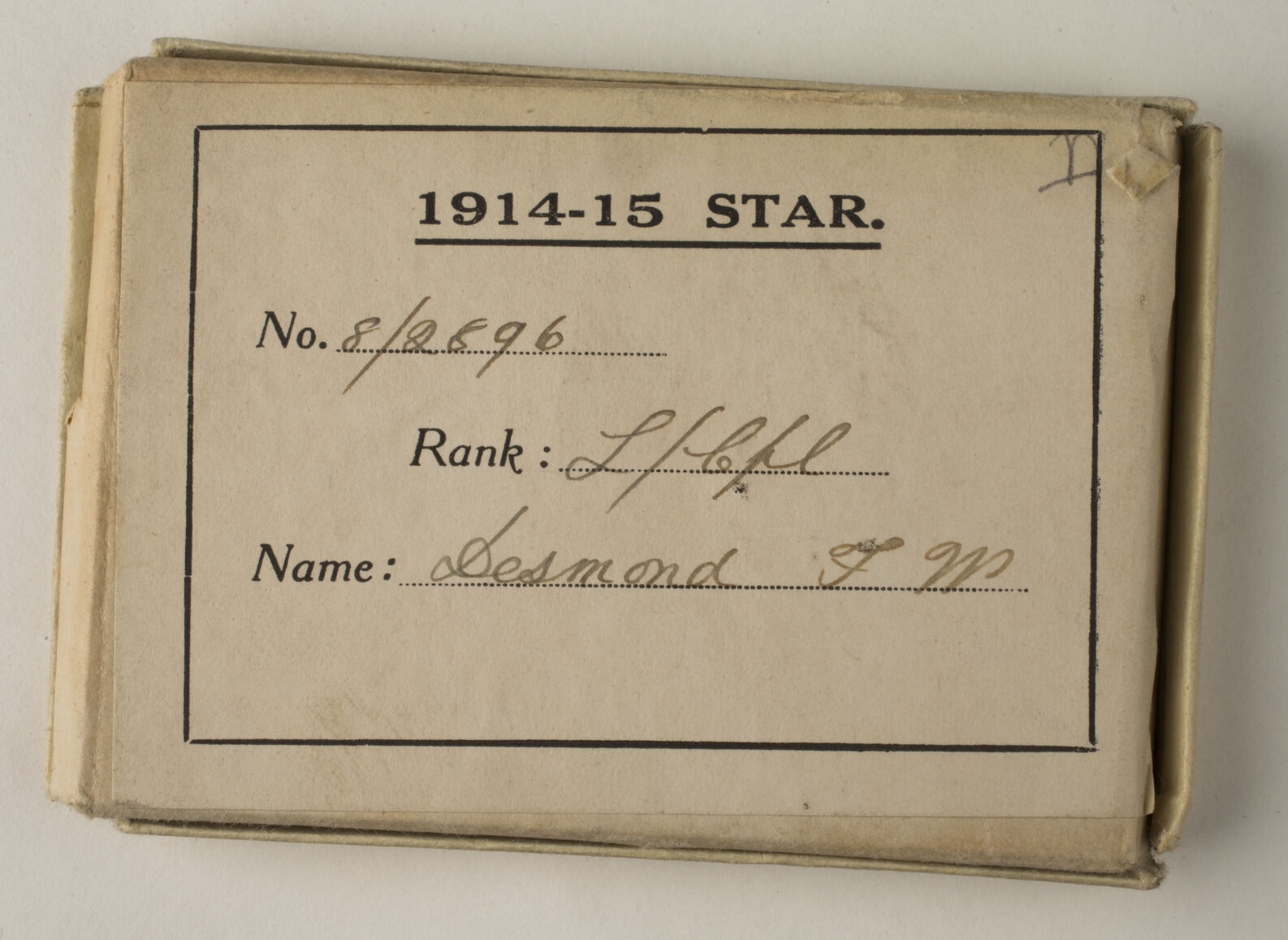 Box and packet that contained 1914 - 1915 Star for Temporary Corporal Francis William Desmond 8/2896