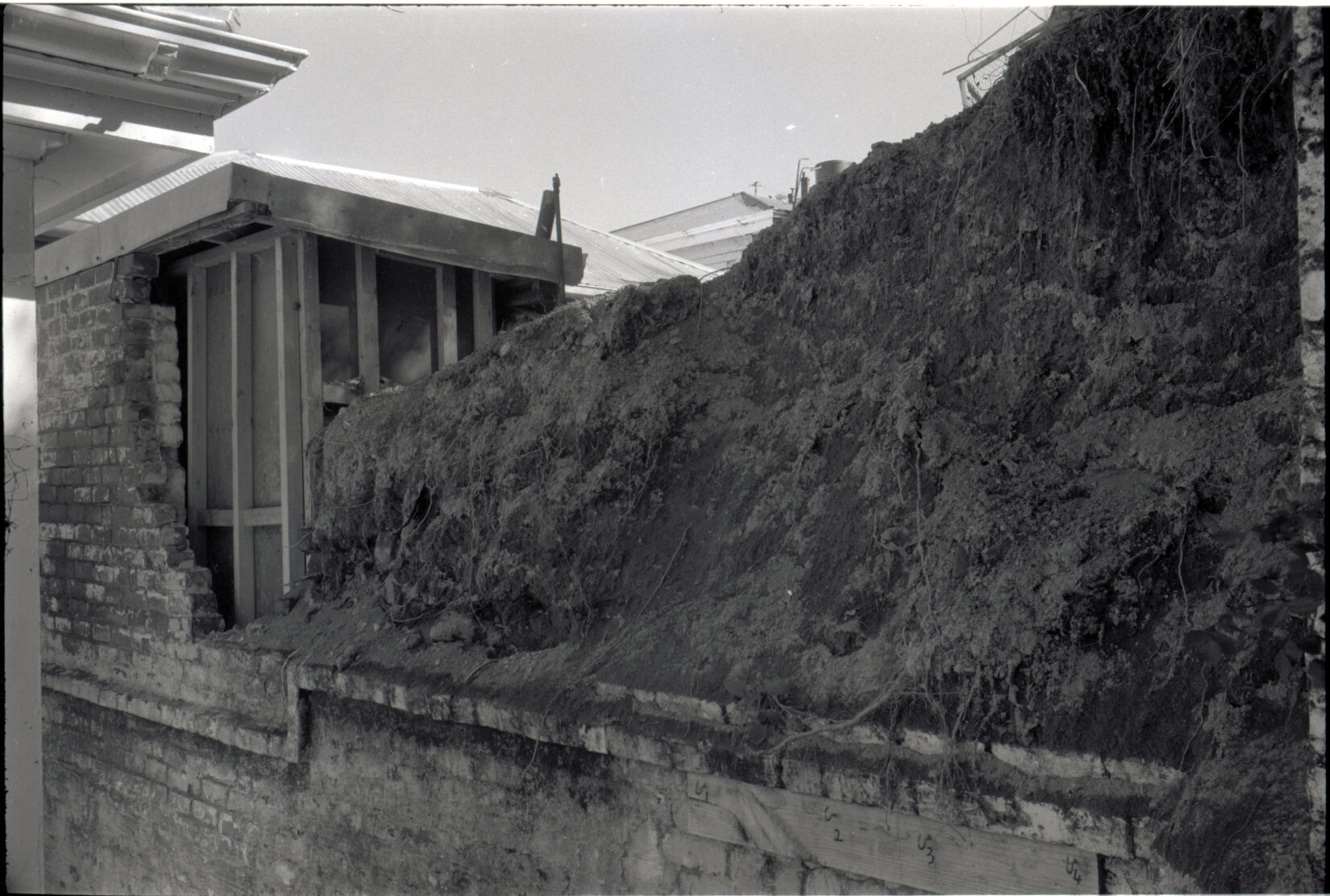 Collapsed brick wall, 16 Reuben Avenue