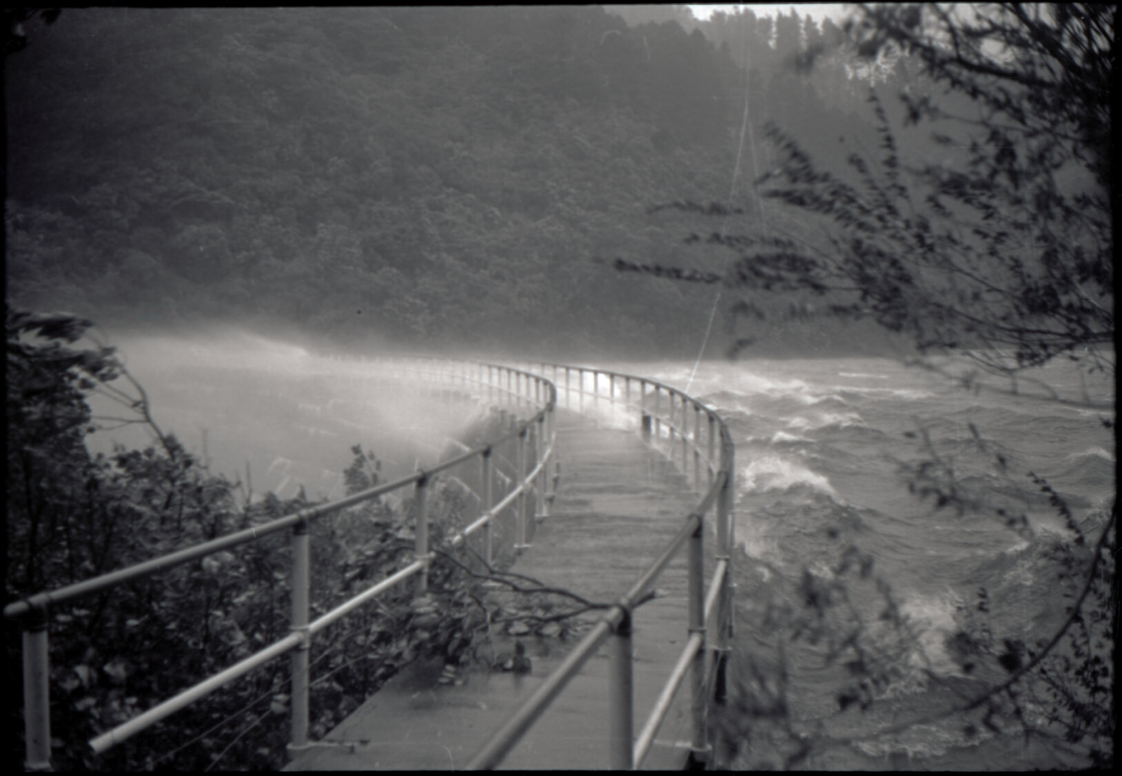 Photograph of water blowing over upper Karori dam during the Wahine storm