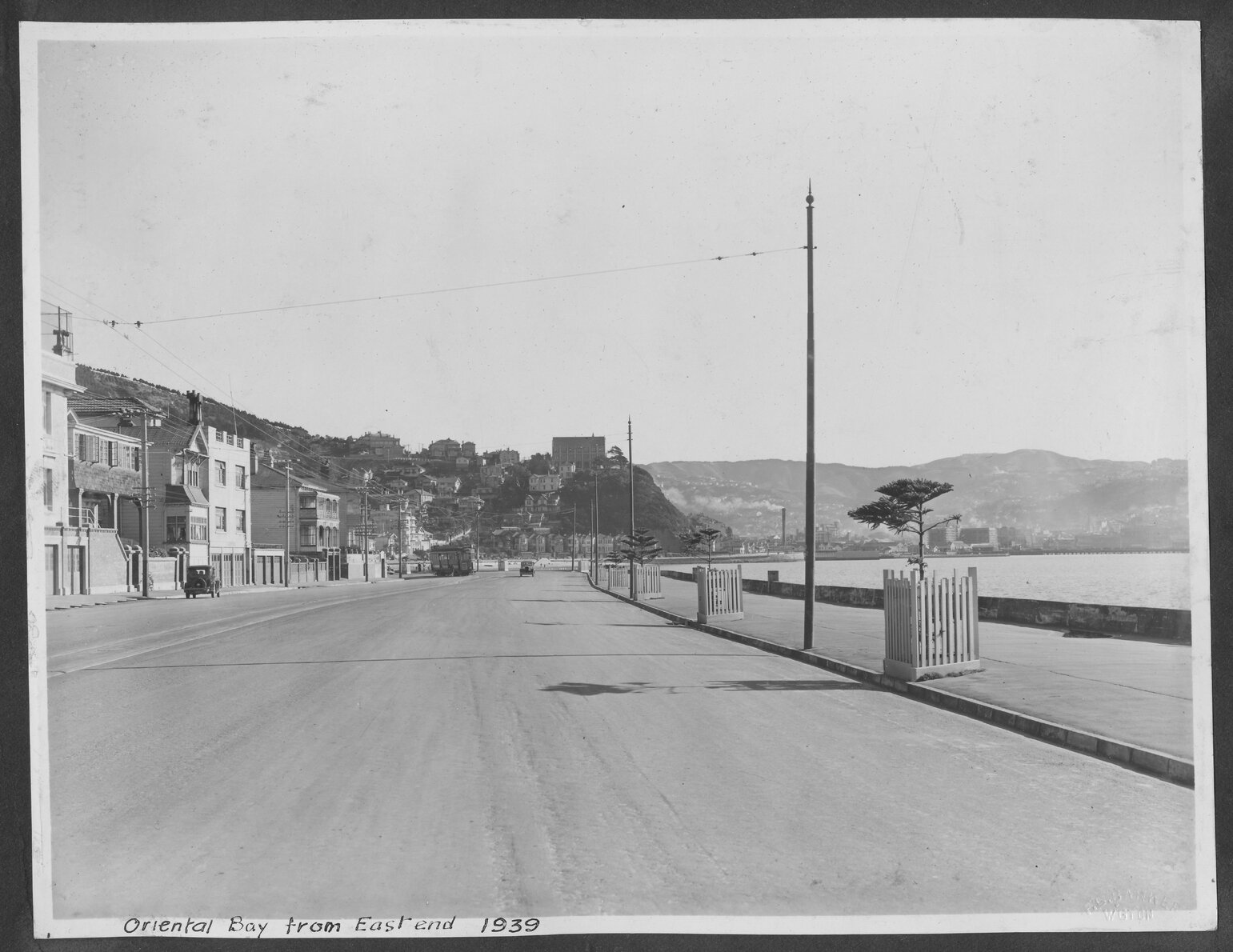 Oriental Bay from the east end, looking towards Te Aro. Motor vehicles in background. 