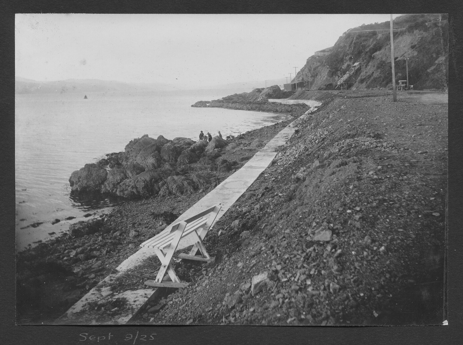East end of Oriental Bay foreshore, looking towards Point Jerningham. Children are playing on the rocks and alterations to foreshore are happening in the background.