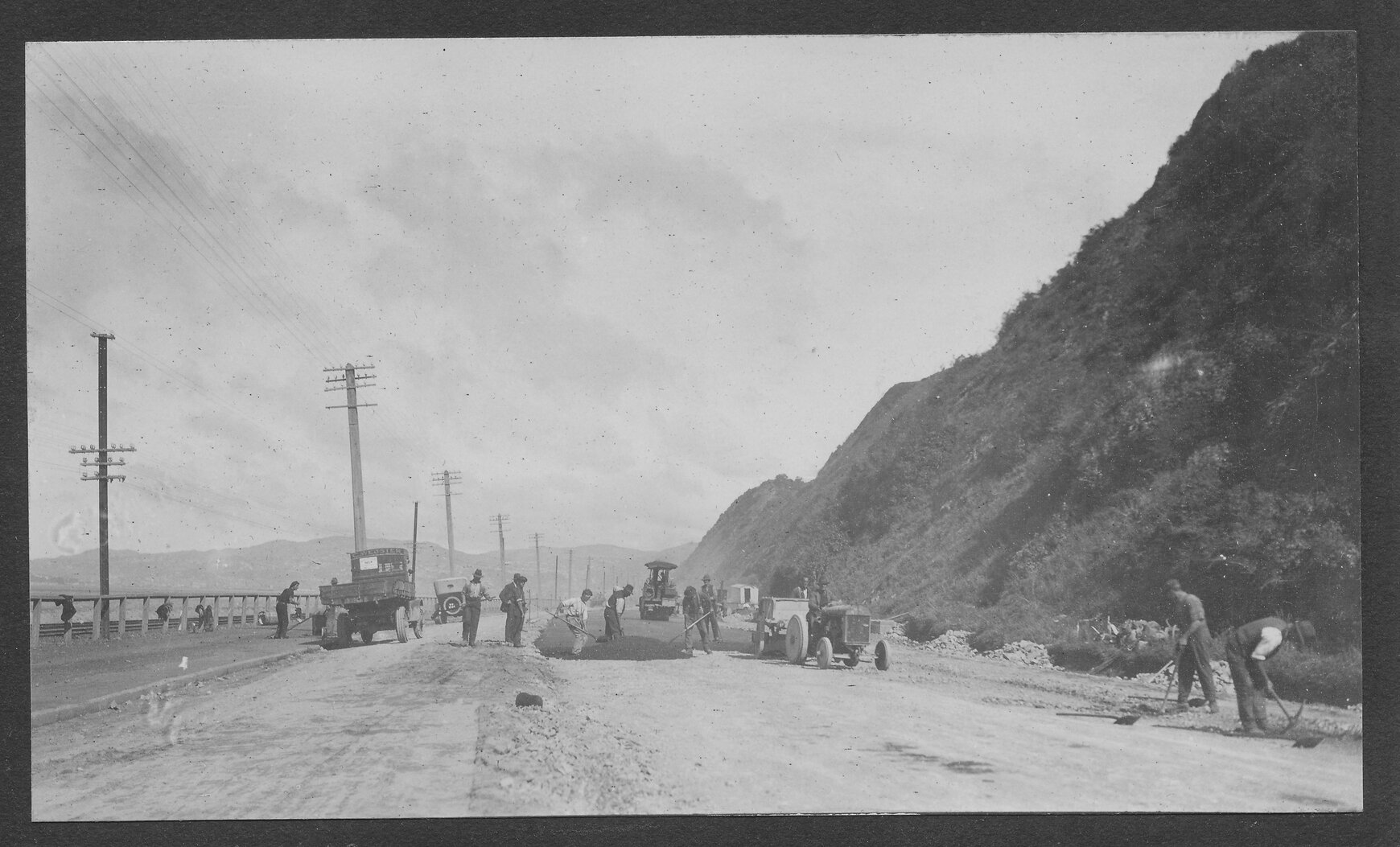Workmen are laying new road seal on Hutt Road.