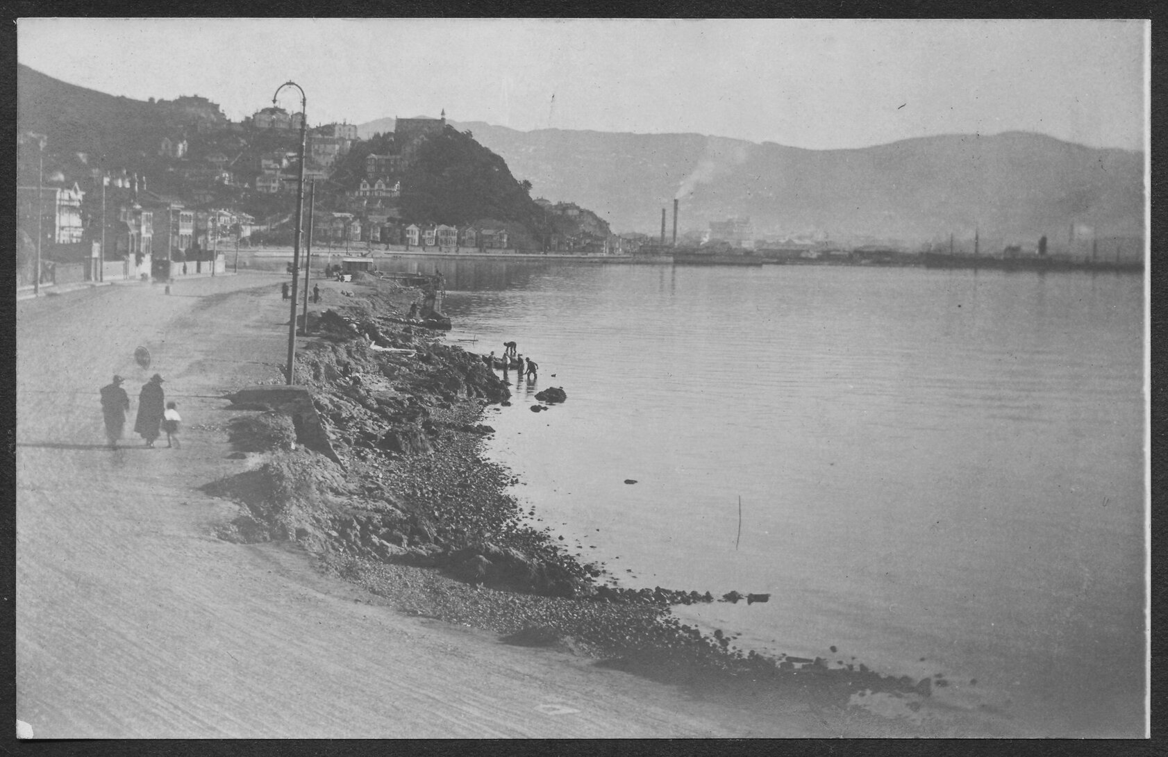 Construction of seawall showing wooden boxing used to support newly poured concrete.