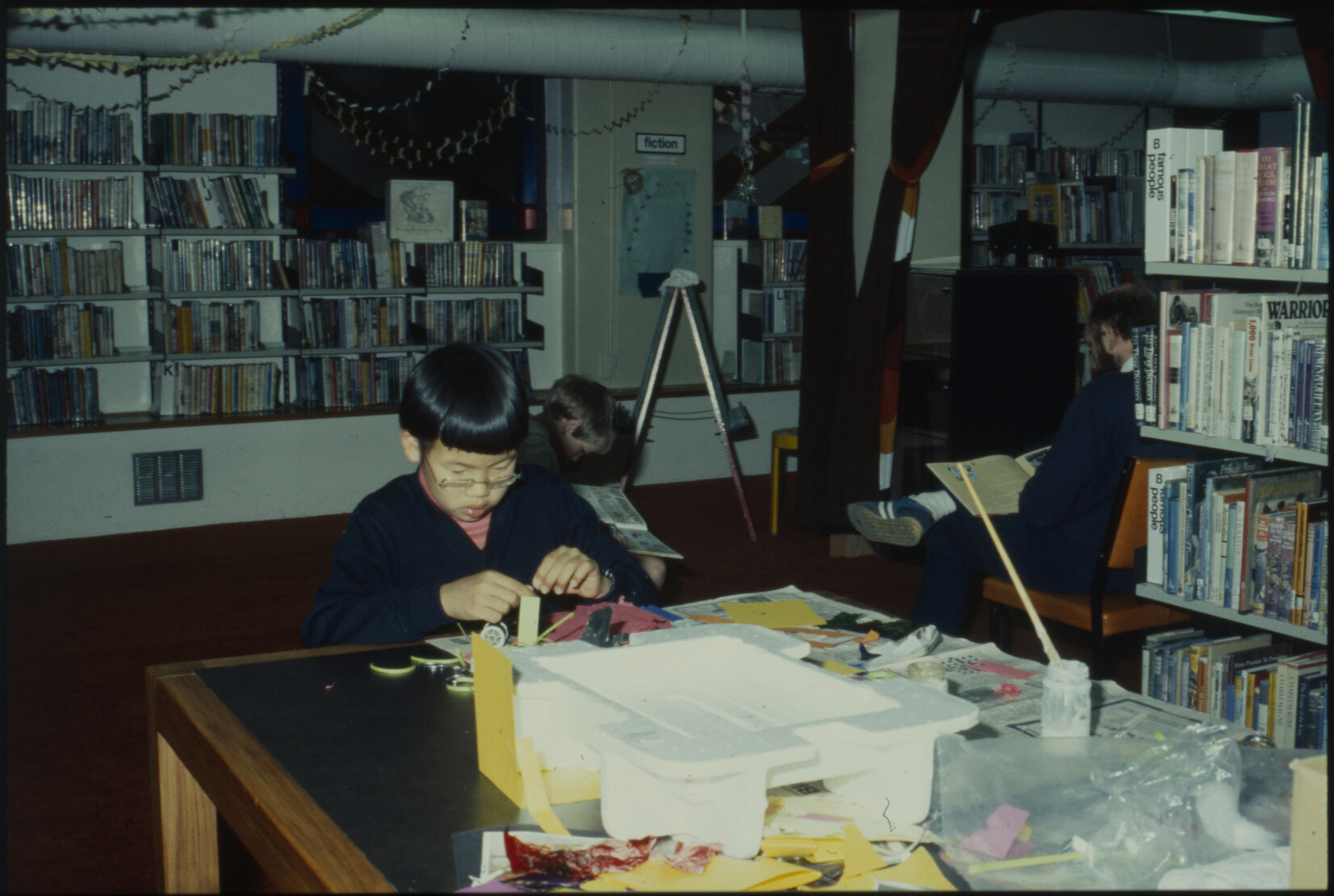Child making Christmas decorations, Children's Library