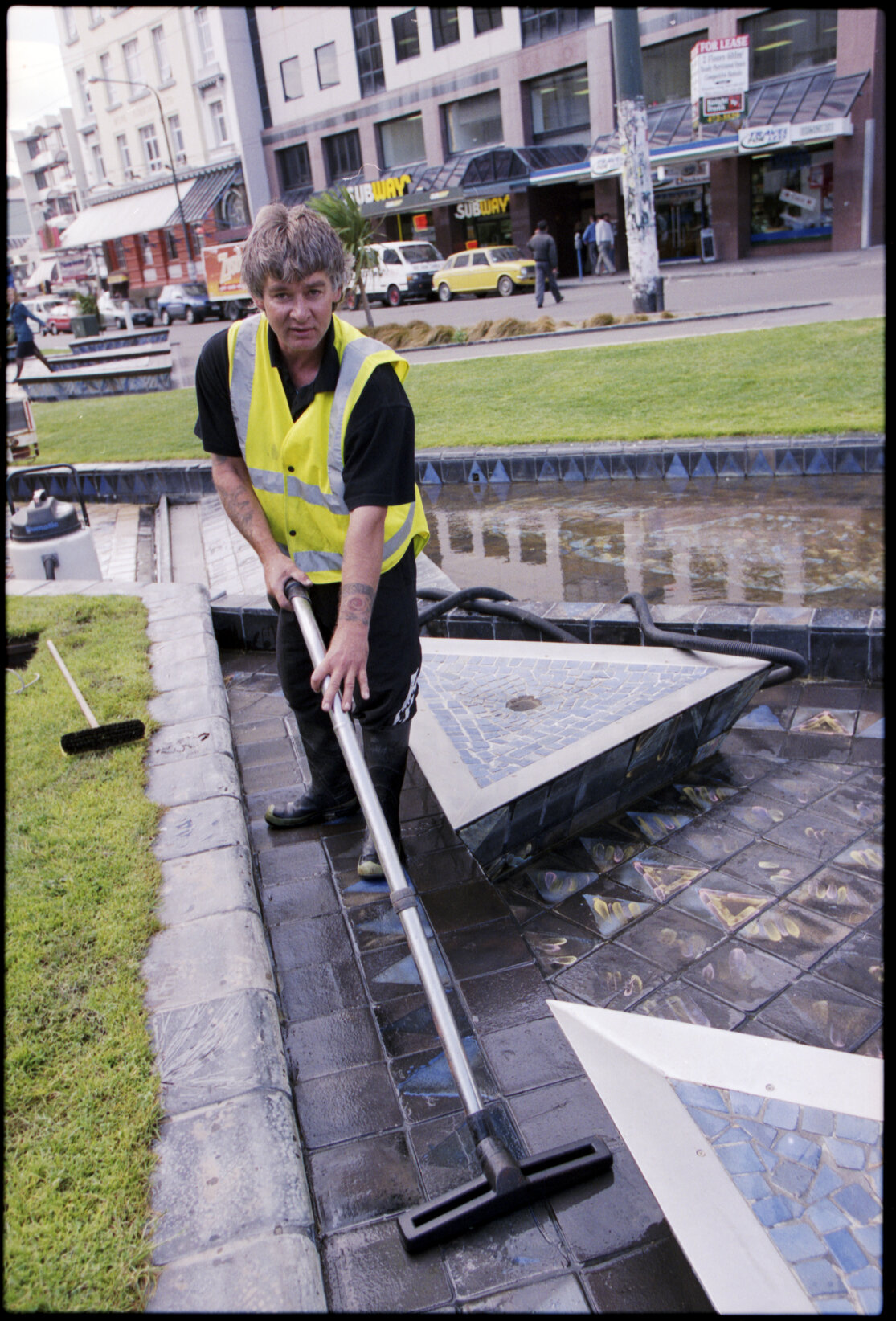 Workman cleaning, Te Aro Park