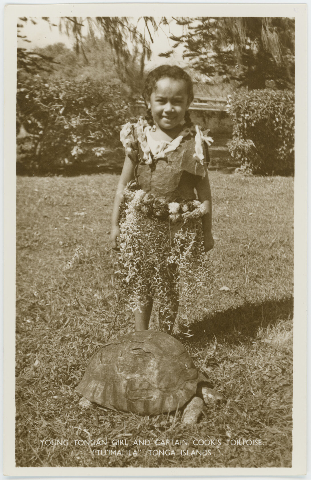 Tongan child with Captain Cook's tortoise, Tonga