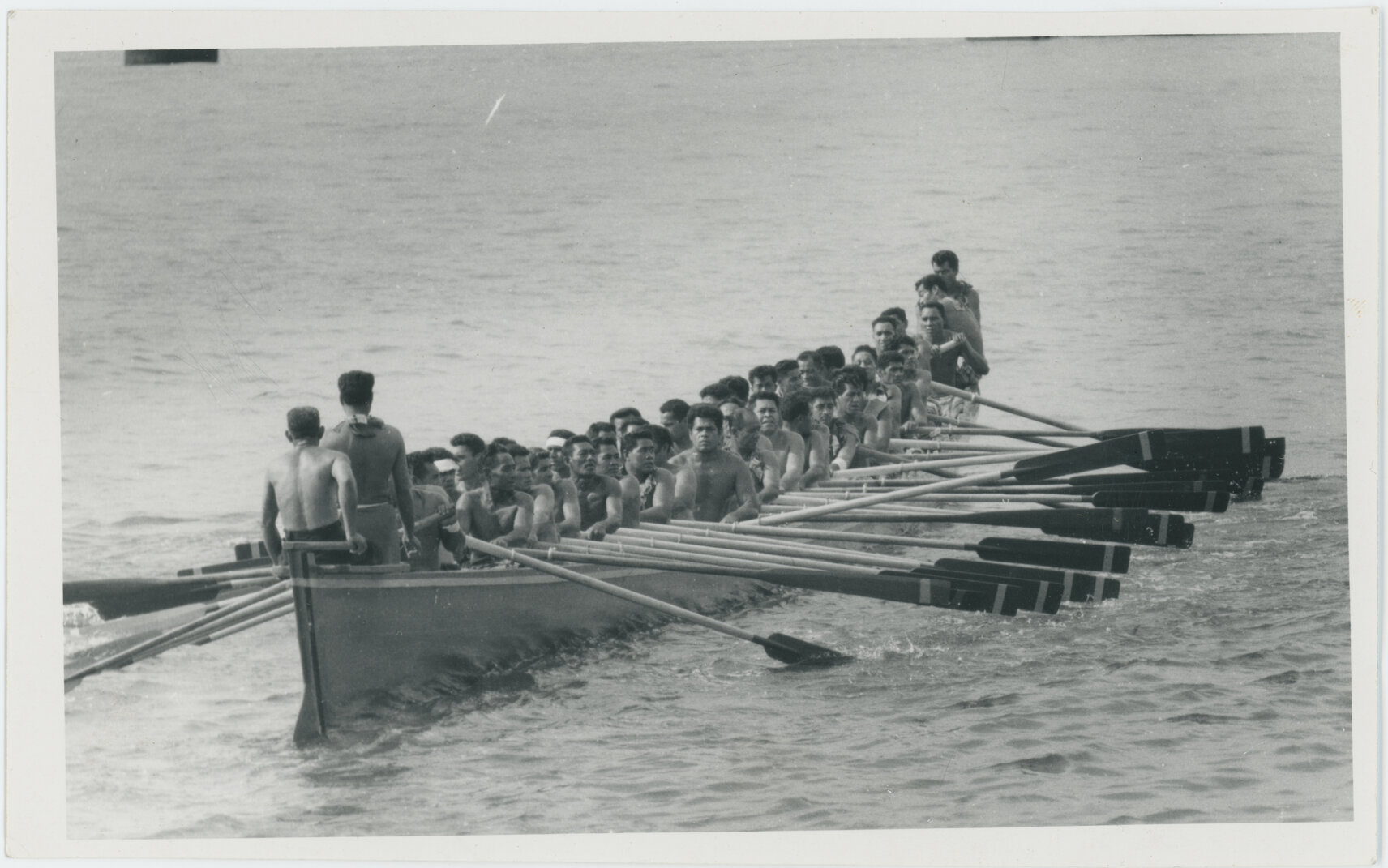 Group of men in fautasi, Apia, Samoa