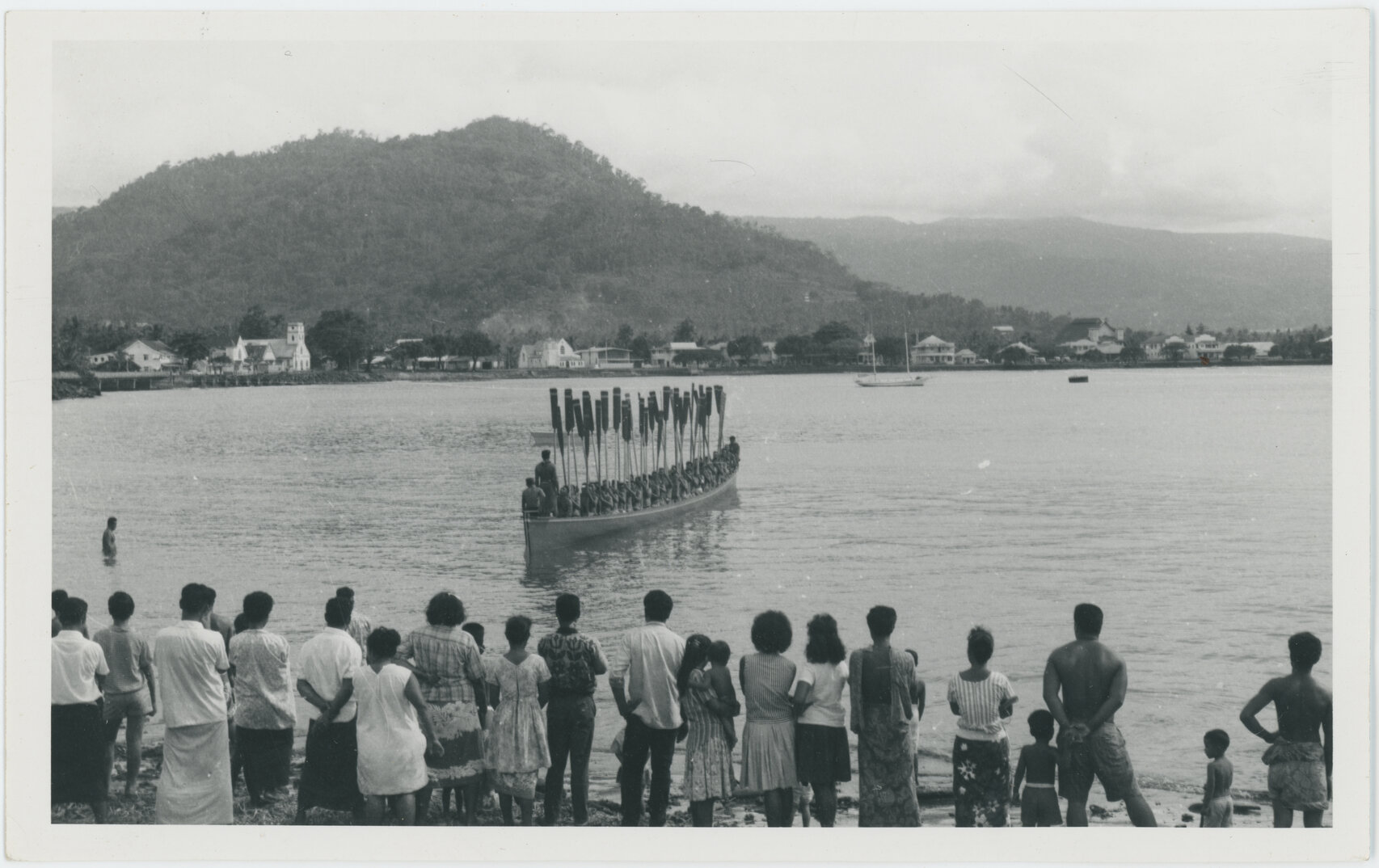 Group of men in fautasi, Apia, Samoa