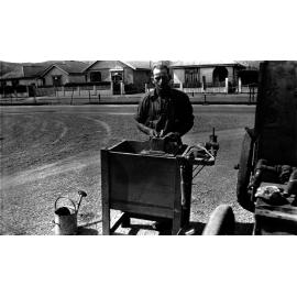 Broadway, workman making the mould for 'Thermit' welding from rail joint