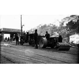 Glenmore Street, workmen operating the Cold Fix Spraying Outfit and Track Roller on newly laid tram rails