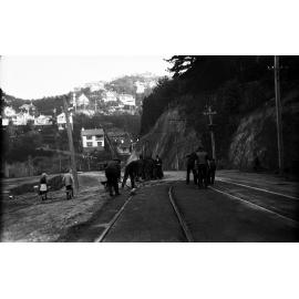 Glenmore Street, workmen operating the Cold Fix Spraying Outfit and Track Roller and finishing surface of completed work on newly laid tram rails