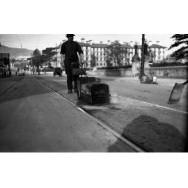 Molesworth Street, workman with an outward track, oil heated Surfacing Machine