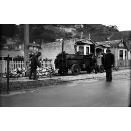 Aro Street, workmen spraying cold fix on newly laid tram rails