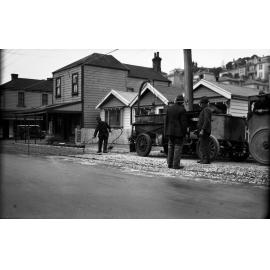 Aro Street, workmen spraying tar on road surface