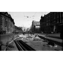 Customhouse Quay, workmen preparing road for laying of new tram rails