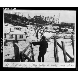 Pat Harnet surveys his timber mill in winter, Brooklyn Hill