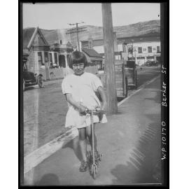 Girl on scooter, Barker Street