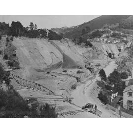 Work in progress, machinery being used for excavation. Seddon memorial in background