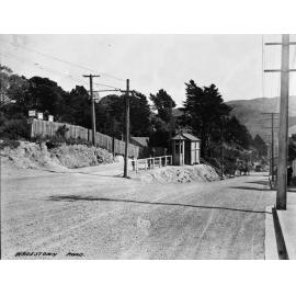Unsealed road. People waiting at Tramstop