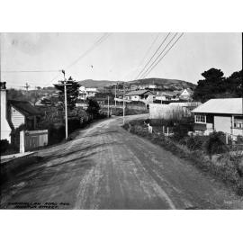 Awarua Street intersection. Wooden dwellings front onto an unsealed Khandallah Road