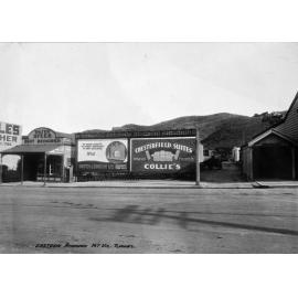 Billboards beside the eastern approach to the Mount Victoria Tunnel, 'Chesterfield Suites' and 'Smith & Smith' for fireplaces