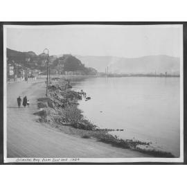 Oriental Bay from the east end, looking towards Te Aro. In the background workmen are in the process of building the seawall.