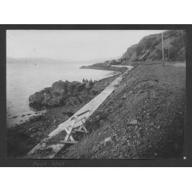 East end of Oriental Bay foreshore, looking towards Point Jerningham. Children are playing on the rocks and alterations to foreshore are happening in the background.