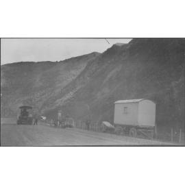 Elevated view of workmen in process of sealing Hutt Road.