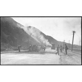 Machinery producing asphalt for new road sealing.