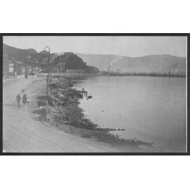 Construction of seawall showing wooden boxing used to support newly poured concrete.