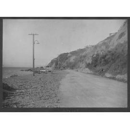 Unsealed road and prior to constrcution of seawall, looking towards Point Jerningham.