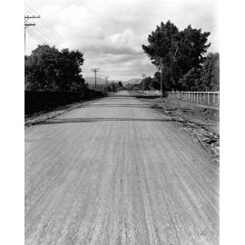 Photograph of the new alsphaltic concrete surface. A rural area with little residential development, Main Hutt Road, December 1925-June 1926