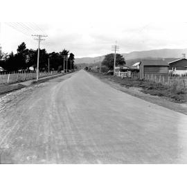 Photograph of the new alsphaltic concrete surface. A rural area with little residential development, Main Hutt Road, December 1925-June 1926