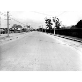 Photograph of the new alsphaltic concrete surface on High Street, previously identified as Main Hutt Road or Cambelltown, Main Street, Cambelltown, Main Street [ High Street, Lower Hutt ], October 1925