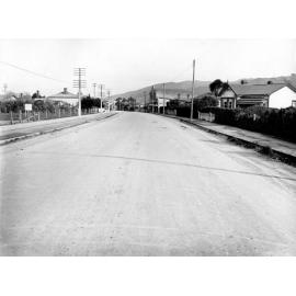 Photograph of the new alsphaltic concrete surface on High Street, previously identified as Main Hutt Road in the Lower Hutt Borough. Area of wooden dwellings, High Street, October 1925