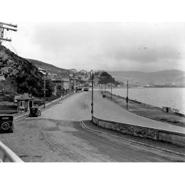 Carlton Gore Road intersection, parked motor vehicles, tram. View across harbour to Te Aro, Oriental Parade, December 1925