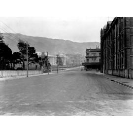 At Molesworth Street, Lambton Quay intersection. Parliament buildings in background, Hotel on corner. Photograph of new asphaltic concrete surface, Bunny Street, May 1926