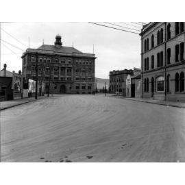 At Waterloo Quay and Customhouse Quay intersection. Photograph of new asphaltic concrete surface, Whitmore Street, December 1925