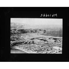 Elevated view of Centennial Exhibition buildings, Lyall Bay, and area to be developed as airport, Rongotai.