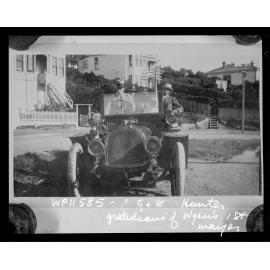 G and E Hunter, grandsons of the first Mayor of Wellington, sitting in an open-topped motor vehicle