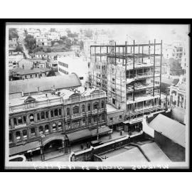 Willis Street, Evening Post building being constructed . Entrance to the Empress Theatre on the left.