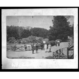 People walking past lake, Newtown Park