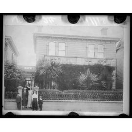 Group of people standing in front of 323 Willis Street