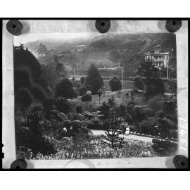 Elevated view of couple sitting on park bench, Botanic Gardens