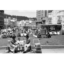 n. People on lawn in front of Opera House