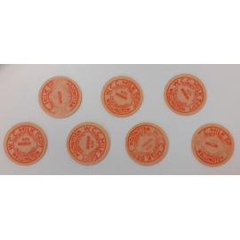 Milk bottle caps in cardboard cylinder